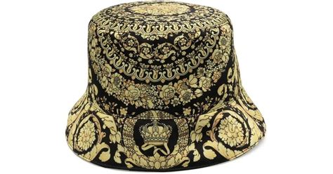 versace cappello oro